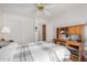 A bedroom with a desk and plenty of space at 11069 E Kilarea Ave # 198, Mesa, AZ 85209