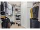 Organized walk-in closet with shelving and ample hanging space for clothes and accessories at 11069 E Kilarea Ave # 198, Mesa, AZ 85209
