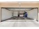 Spacious garage with storage cabinets and room for multiple vehicles at 11069 E Kilarea Ave # 198, Mesa, AZ 85209