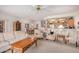 Spacious living room with an open floor plan, connecting to the dining area and kitchen, perfect for entertaining at 11069 E Kilarea Ave # 198, Mesa, AZ 85209