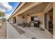 Covered patio with dining and grilling area perfect for outdoor entertaining at 11069 E Kilarea Ave # 198, Mesa, AZ 85209