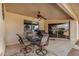 Relaxing covered patio with a ceiling fan and outdoor seating area at 11069 E Kilarea Ave # 198, Mesa, AZ 85209
