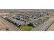 Aerial view of a new construction community, revealing the layout, streets, and surrounding green spaces at 11426 E Utopia Ave, Mesa, AZ 85212
