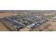 Aerial view of a new construction community in a desert setting, highlighting the street layout and house placement at 11426 E Utopia Ave, Mesa, AZ 85212
