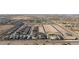 An aerial view of new construction community in a desert setting, showcasing the layout and surrounding landscape at 11426 E Utopia Ave, Mesa, AZ 85212