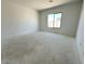 Well-lit bedroom with ample natural light and neutral tones, offering a blank canvas for personalization at 11426 E Utopia Ave, Mesa, AZ 85212