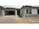 Exterior view of new home construction with a two-car garage and stucco facade at 11426 E Utopia Ave, Mesa, AZ 85212