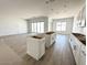 Open-concept kitchen with large windows and sliding glass doors, ready for customization and modern living at 11426 E Utopia Ave, Mesa, AZ 85212