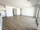 Spacious living room with wood-look floors and sliding doors for natural light at 11426 E Utopia Ave, Mesa, AZ 85212