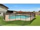 Backyard pool and play area is surrounded by artificial turf at 11652 N 49Th Dr, Glendale, AZ 85304