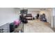 Basement area featuring neutral tile flooring and various furniture pieces for flexible use at 11652 N 49Th Dr, Glendale, AZ 85304
