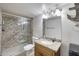 Stylish bathroom featuring granite countertop and a shower with beautiful stone-look tile at 11652 N 49Th Dr, Glendale, AZ 85304