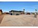 View of the spacious driveway with a motorcycle and Jeep parked in front of the property at 11652 N 49Th Dr, Glendale, AZ 85304