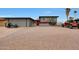 Two-story home with gravel landscaping, black motorcycle and orange Jeep out front at 11652 N 49Th Dr, Glendale, AZ 85304