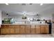 Spacious kitchen area with expansive countertops, cabinetry, and three ceiling fans at 11652 N 49Th Dr, Glendale, AZ 85304