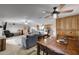 Open floor plan showing the dining room, living room, and kitchen with abundant natural light at 11652 N 49Th Dr, Glendale, AZ 85304