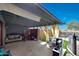 Covered patio features outdoor seating, play kitchen and backyard access at 11652 N 49Th Dr, Glendale, AZ 85304