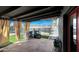 Covered patio offering outdoor space with partial views of the backyard pool and recreational features at 11652 N 49Th Dr, Glendale, AZ 85304