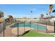 Relaxing fenced pool area with playset and mature palm trees at 11652 N 49Th Dr, Glendale, AZ 85304