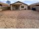 Private backyard with low-maintenance landscaping, ideal for outdoor relaxation and entertainment at 11734 W Paradise Dr, El Mirage, AZ 85335