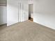 Bedroom with a closet and carpet at 11734 W Paradise Dr, El Mirage, AZ 85335