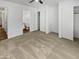 Bedroom with a ceiling fan, a bathroom, and closet space at 11734 W Paradise Dr, El Mirage, AZ 85335