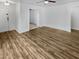 Spacious living room with wood flooring, ceiling fan, and open layout perfect for entertaining at 11734 W Paradise Dr, El Mirage, AZ 85335
