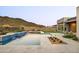 Resort-style backyard with pool, cascading waterfall, putting green, and mountain views at 14102 E Sonora Crest Dr, Fountain Hills, AZ 85268