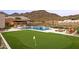 Outdoor living at its finest with a pool, putting green, BBQ island, and mountain views at 14102 E Sonora Crest Dr, Fountain Hills, AZ 85268