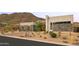 Modern home featuring desert landscaping, stone accents, and mountain views at 14102 E Sonora Crest Dr, Fountain Hills, AZ 85268