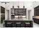 Contemporary kitchen with dark wood cabinets, stainless steel appliances, and a large island at 14102 E Sonora Crest Dr, Fountain Hills, AZ 85268