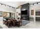 Modern living room with a stone fireplace, comfortable seating, and elegant decor at 14102 E Sonora Crest Dr, Fountain Hills, AZ 85268