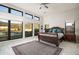 Bright main bedroom with large windows, marble floors, and ornate wooden bed frame at 14102 E Sonora Crest Dr, Fountain Hills, AZ 85268