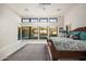 Main bedroom features large windows with views, ceiling fan, and decorative rug at 14102 E Sonora Crest Dr, Fountain Hills, AZ 85268
