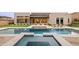 Beautiful pool and spa area with a putting green, fire pit, and modern home exterior at 14102 E Sonora Crest Dr, Fountain Hills, AZ 85268