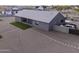 Backyard view of a single-story home with a covered patio and spacious gravel landscape at 1455 E Dove Pl, Casa Grande, AZ 85122