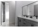 Well lit bathroom with dual sinks and quartz countertops. The room also features lots of cabinet space at 1455 E Dove Pl, Casa Grande, AZ 85122