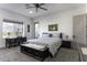 Serene bedroom featuring soft gray carpet, a window view, and decorative touches at 1455 E Dove Pl, Casa Grande, AZ 85122