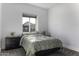 Comfortable bedroom with a window view of a neighbor's home and a comfortable mattress at 1455 E Dove Pl, Casa Grande, AZ 85122