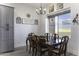 Elegant dining room with a wooden table, chandelier, and decor at 1455 E Dove Pl, Casa Grande, AZ 85122