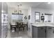Bright dining area featuring a wooden table, artwork, and ample natural light at 1455 E Dove Pl, Casa Grande, AZ 85122