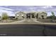 View of house with large horseshoe driveway and rock landscaping at 1455 E Dove Pl, Casa Grande, AZ 85122