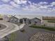 Stunning single-story home featuring a circular driveway and well-manicured desert landscaping at 1455 E Dove Pl, Casa Grande, AZ 85122