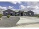 Beautiful single story home boasts an elongated driveway and lovely landscaping at 1455 E Dove Pl, Casa Grande, AZ 85122