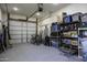 A well-lit garage featuring ample storage, a traditional garage door, and plenty of open space at 1455 E Dove Pl, Casa Grande, AZ 85122