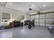 Spacious garage with epoxy flooring, ample storage, and a motorcycle at 1455 E Dove Pl, Casa Grande, AZ 85122