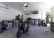 Spacious garage featuring epoxy flooring, overhead storage racks, and plentiful storage containers at 1455 E Dove Pl, Casa Grande, AZ 85122