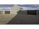 Detached garage, gray stucco exterior, secure gates, and gravel driveway at 1455 E Dove Pl, Casa Grande, AZ 85122