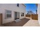 Backyard featuring stucco exterior with a sliding glass door and a fenced perimeter at 14628 W Sand Hills Rd, Surprise, AZ 85387