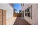 Backyard featuring stucco exterior with a sliding glass door and a fenced perimeter at 14628 W Sand Hills Rd, Surprise, AZ 85387